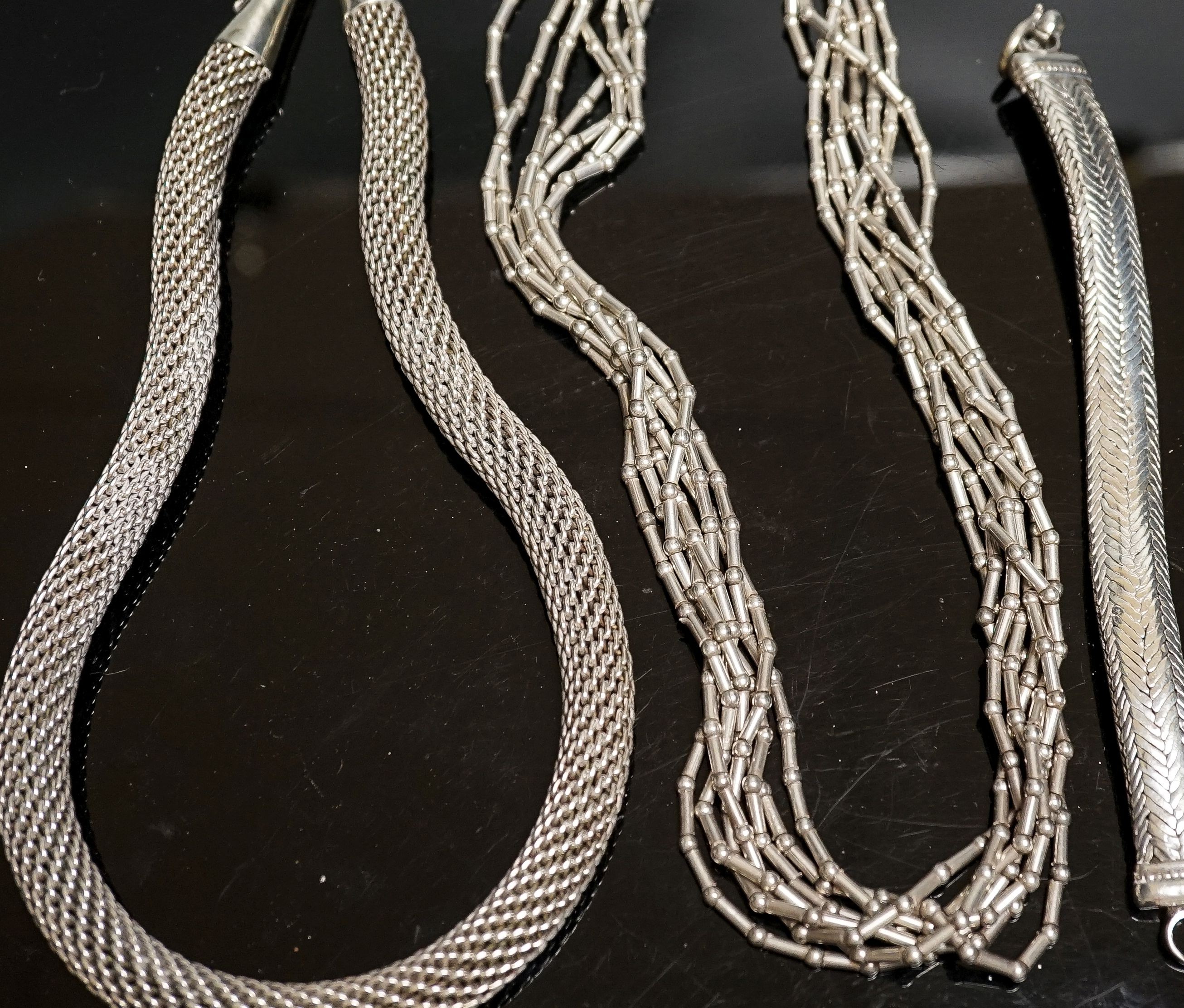 A 925 torque necklace, 46cm, a 925 multi strand necklace and a bracelet